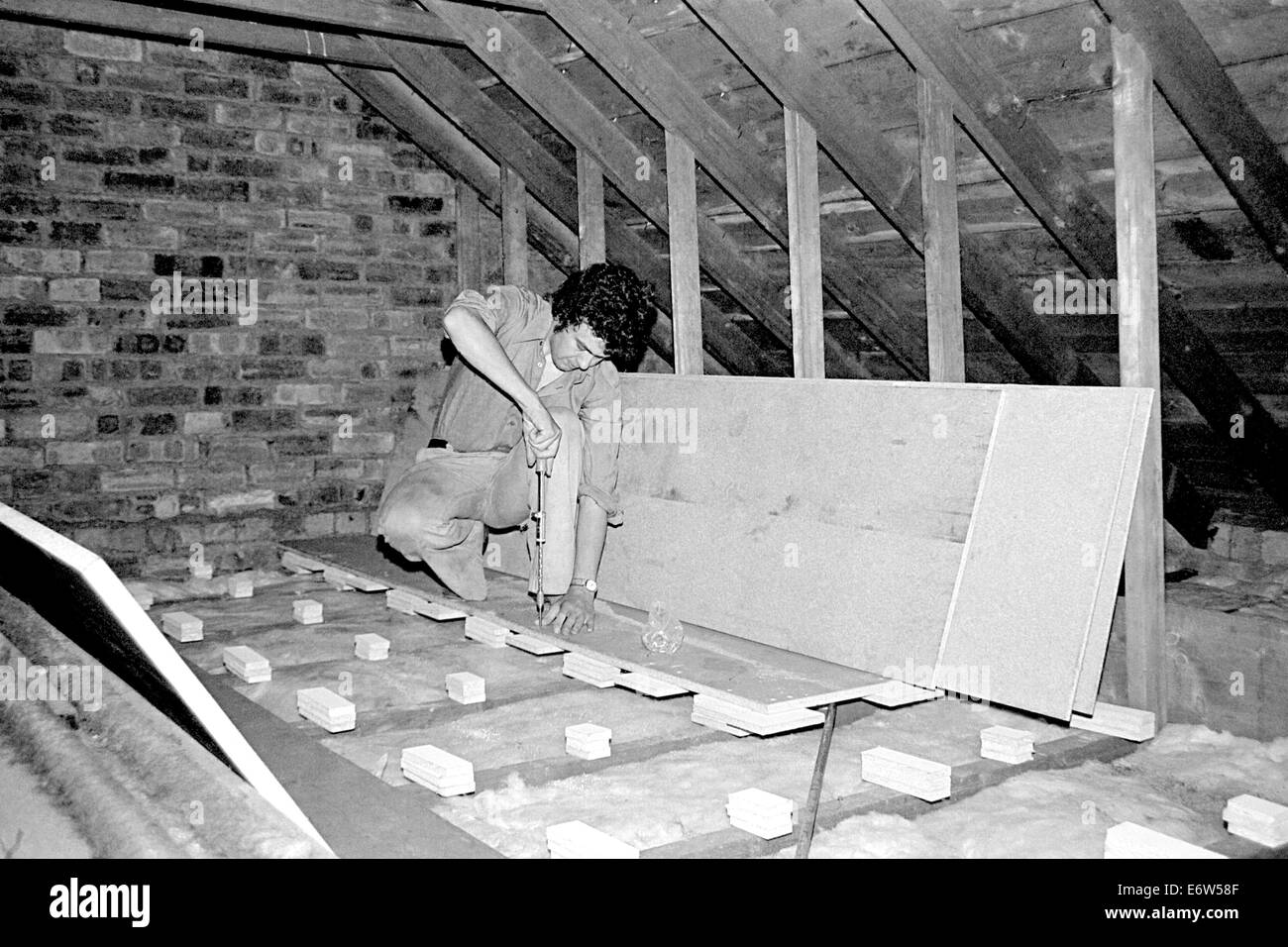 Putting down the floor for the darkroom in 1978 Stock Photo
