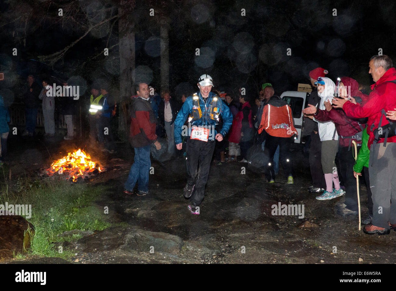 American ultra runner Emily RICHARDS-CHISHOLM moves through the Notre Dame de la Gorge section of the UTMB race in France. She placed 5th Senior woman in the race. Runners battled several hours of rain and ran through the night during the annual mountain ultra marathon in Chamonix France. The race takes the runners through 3 alpine countries (France, Switzerland and Italy), over many high mountain passes for a total of 163km of running and 9600m of height gain total while circumnavigating the Mont Blanc massif. The race is conducted in semi-autonomy with only a few stops for food and water. Th Stock Photo