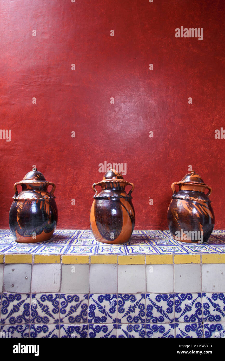 Clay pots sit on a tiled counter in the historic Casa Alfeñique in Puebla, Mexico. Stock Photo