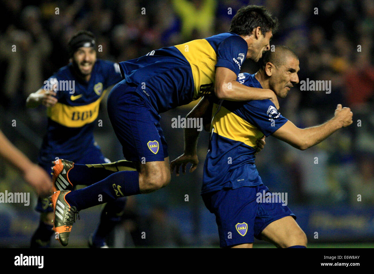 Buenos Aires, Argentina. 31st Aug, 2014. The player Daniel Diaz (R) of Boca Juniors, celebrates a scoring with his teammate Marcelo Meli (C), during the match of the Argentinean First Division Tournament against Velez Sarsfield, in the Alberto J. Armando Stadium, in Buenos Aires, Argentina, on Aug. 31, 2014. (Xinhua/Martin Zabala) (jp) (ah) Credit:  Xinhua/Alamy Live News Stock Photo