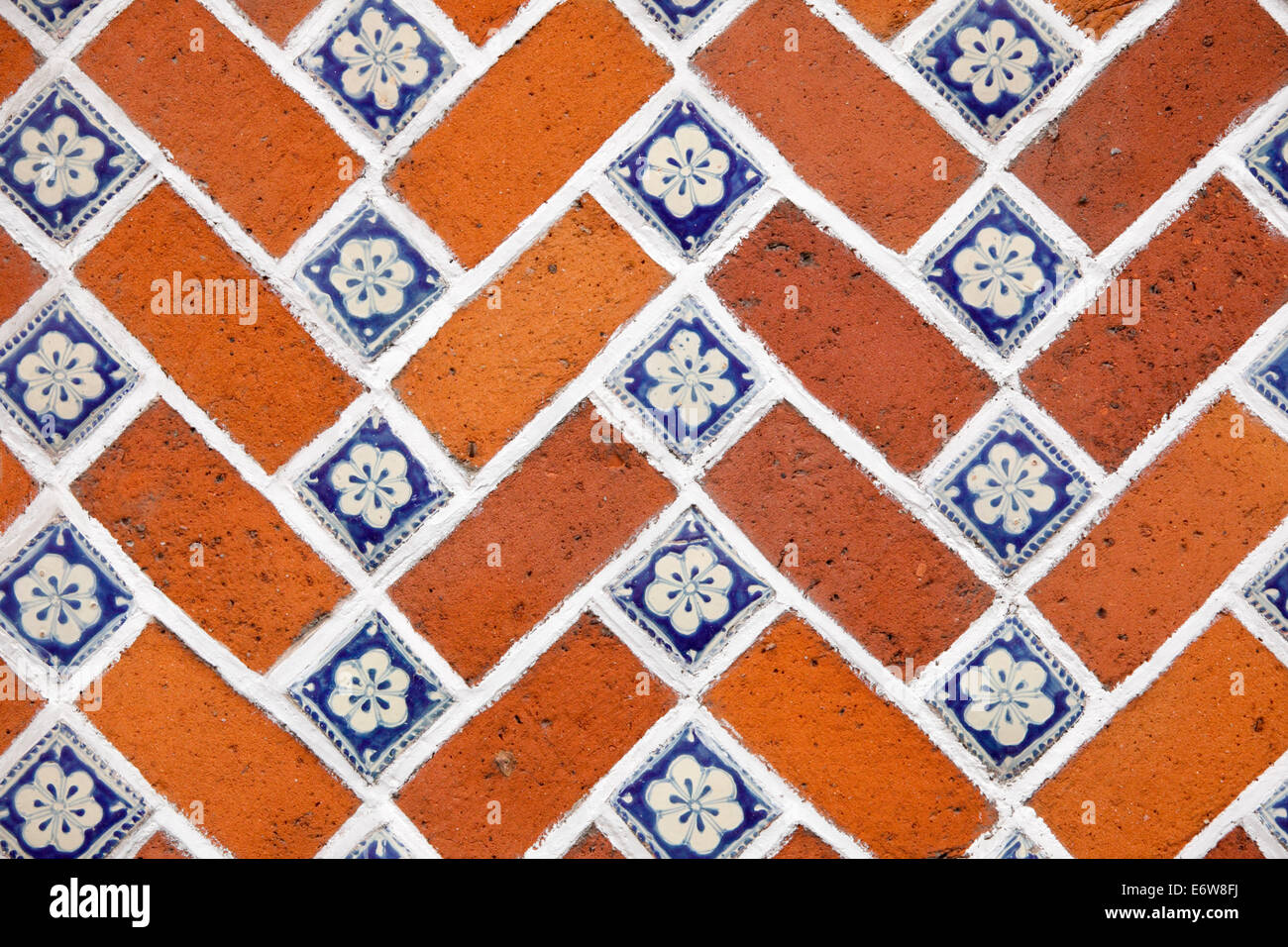 Detail of a tile and brick wall in Puebla, Mexico. Stock Photo