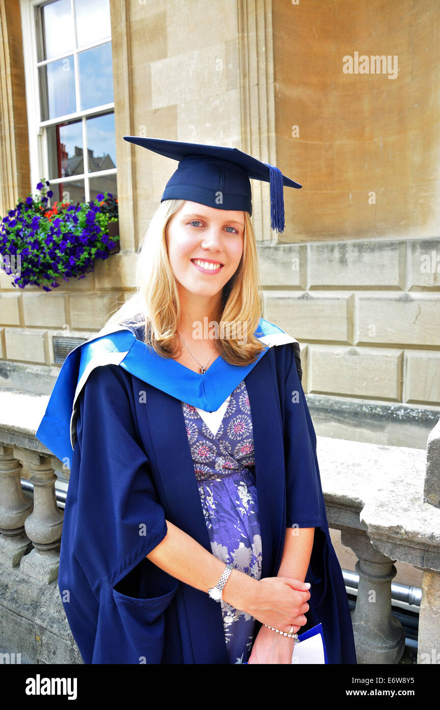 Young woman wearing postgraduation gown, Bath, Somerset, England, United Kingdom Stock Photo
