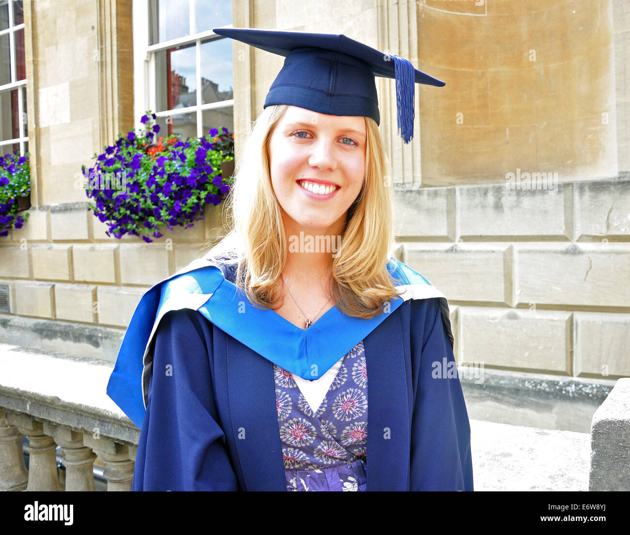 Young woman wearing postgraduation gown, Bath, Somerset, England, United Kingdom Stock Photo