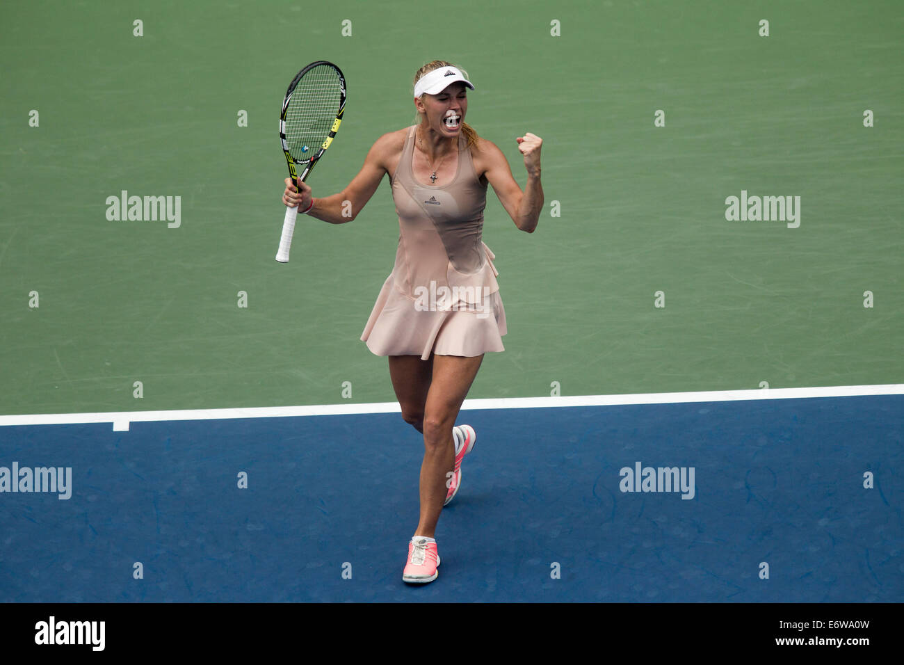 Flushing Meadows, NY, USA. 31th Aug, 2014. Caroline Wozniacki (DEN) reacts at match point after defeating Maria Sharapova (RUS)  in 4th round action at the US Open Tennis Championships. Credit:  PCN Photography/Alamy Live News Stock Photo