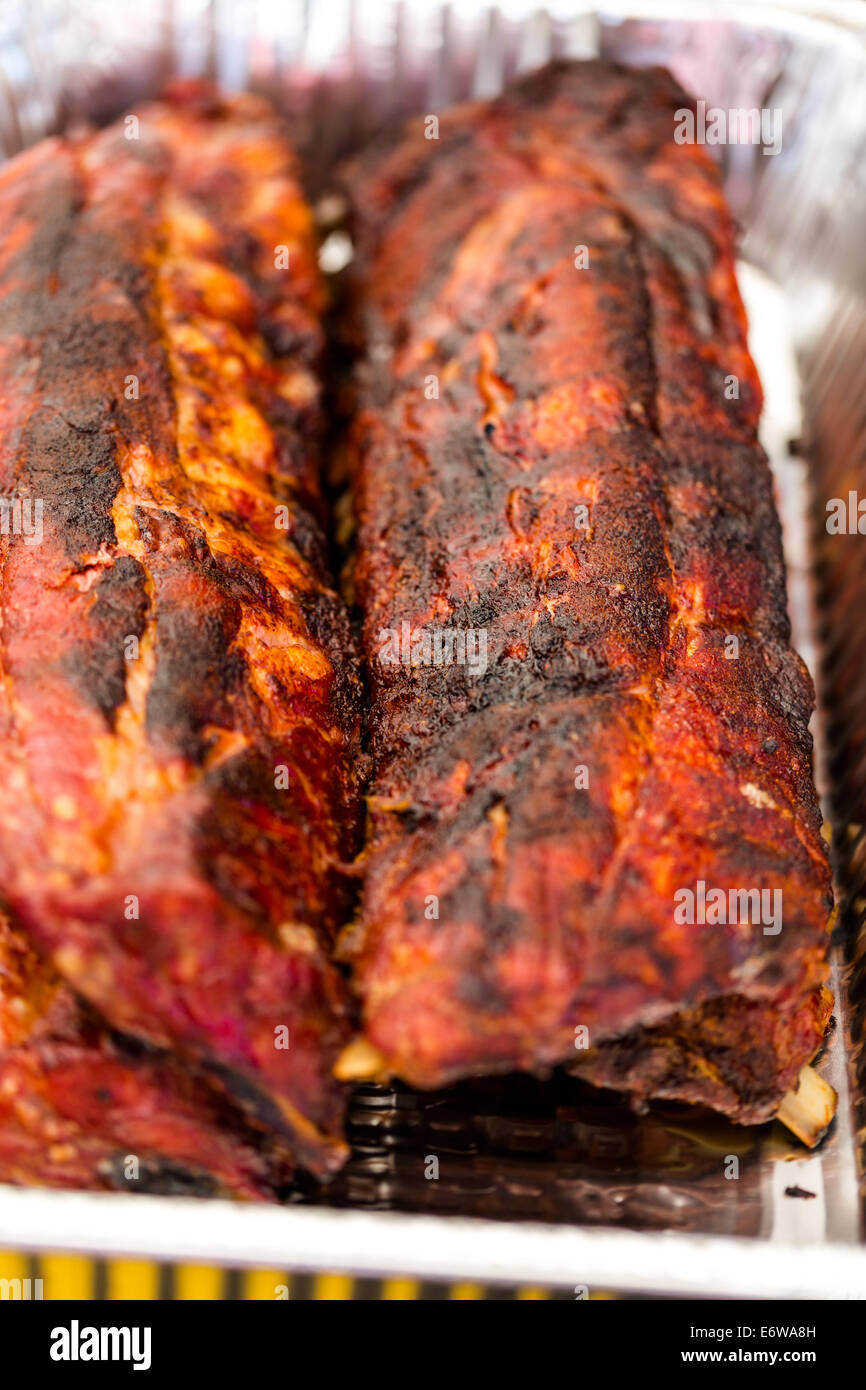 Baby back ribs prepared in smoker in foil tin Stock Photo Alamy