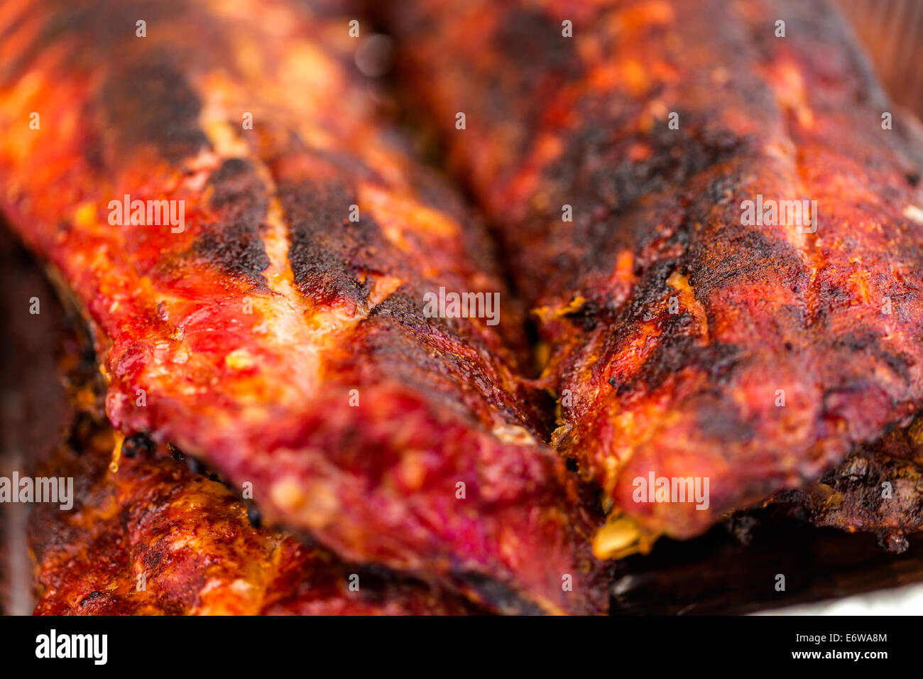 Baby back ribs prepared in smoker in foil tin Stock Photo Alamy
