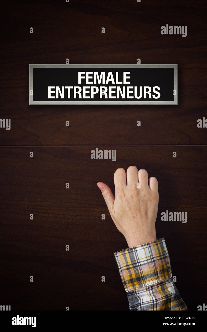 Woman hand is knocking on Female entrepreneurs door, conceptual image Stock Photo