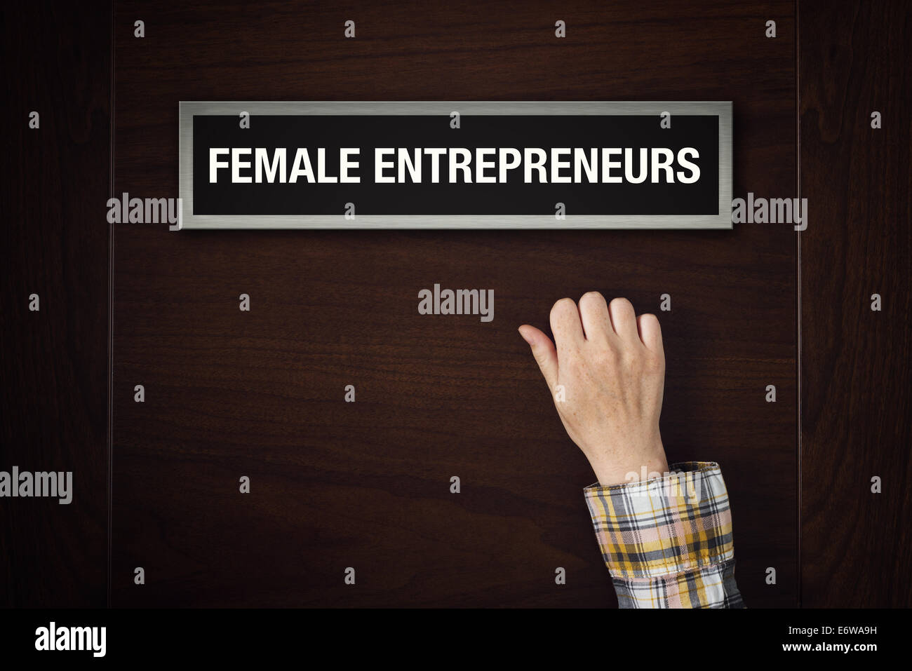 Woman hand is knocking on Female entrepreneurs door, conceptual image Stock Photo