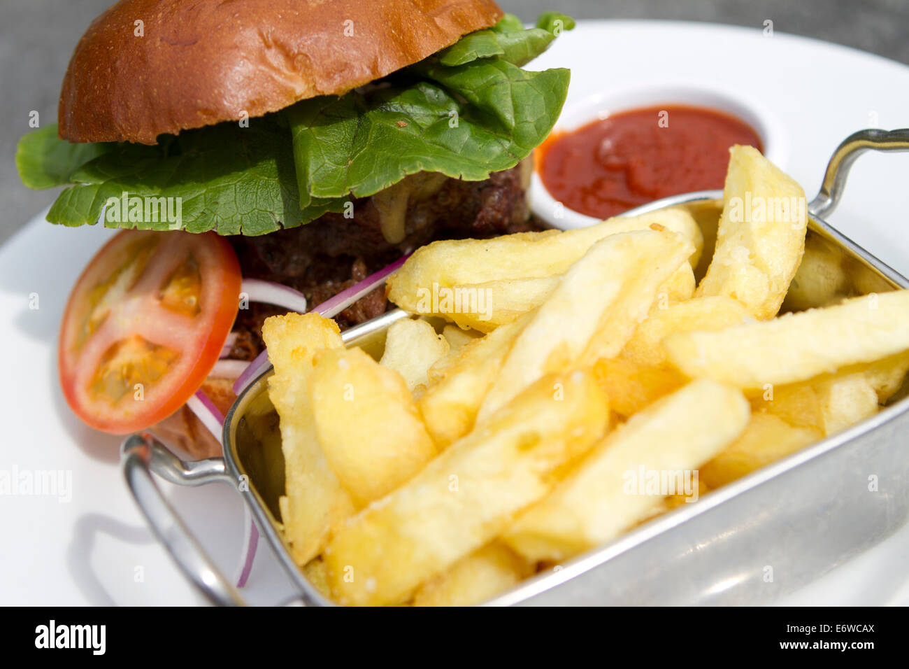 Gastropub burger and chips at The Black Swan, Ockham, Surrey. Stock Photo
