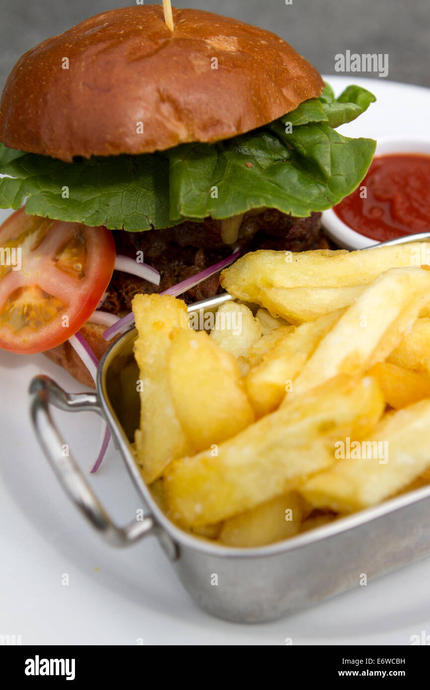 Gastropub burger and chips at The Black Swan, Ockham, Surrey. Stock Photo