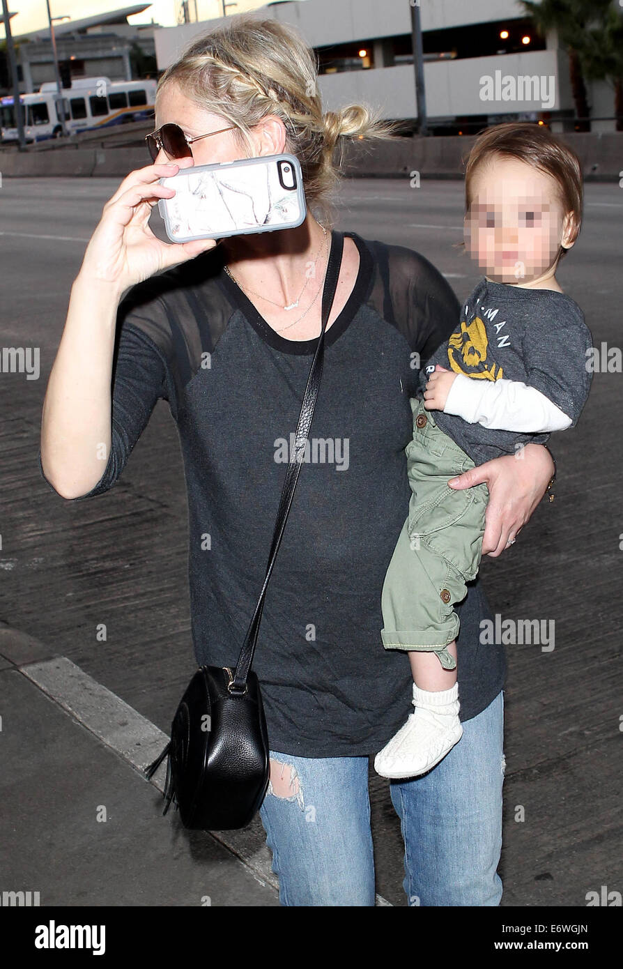 Sarah Michelle Gellar and husband Freddie Prinze, Jr arrive at Los Angeles  International (LAX) airport with their daughter Charlotte and son Rocky  Featuring: Sarah Michelle Gellar,Rocky Prinze Where: Los Angeles,  California, United
