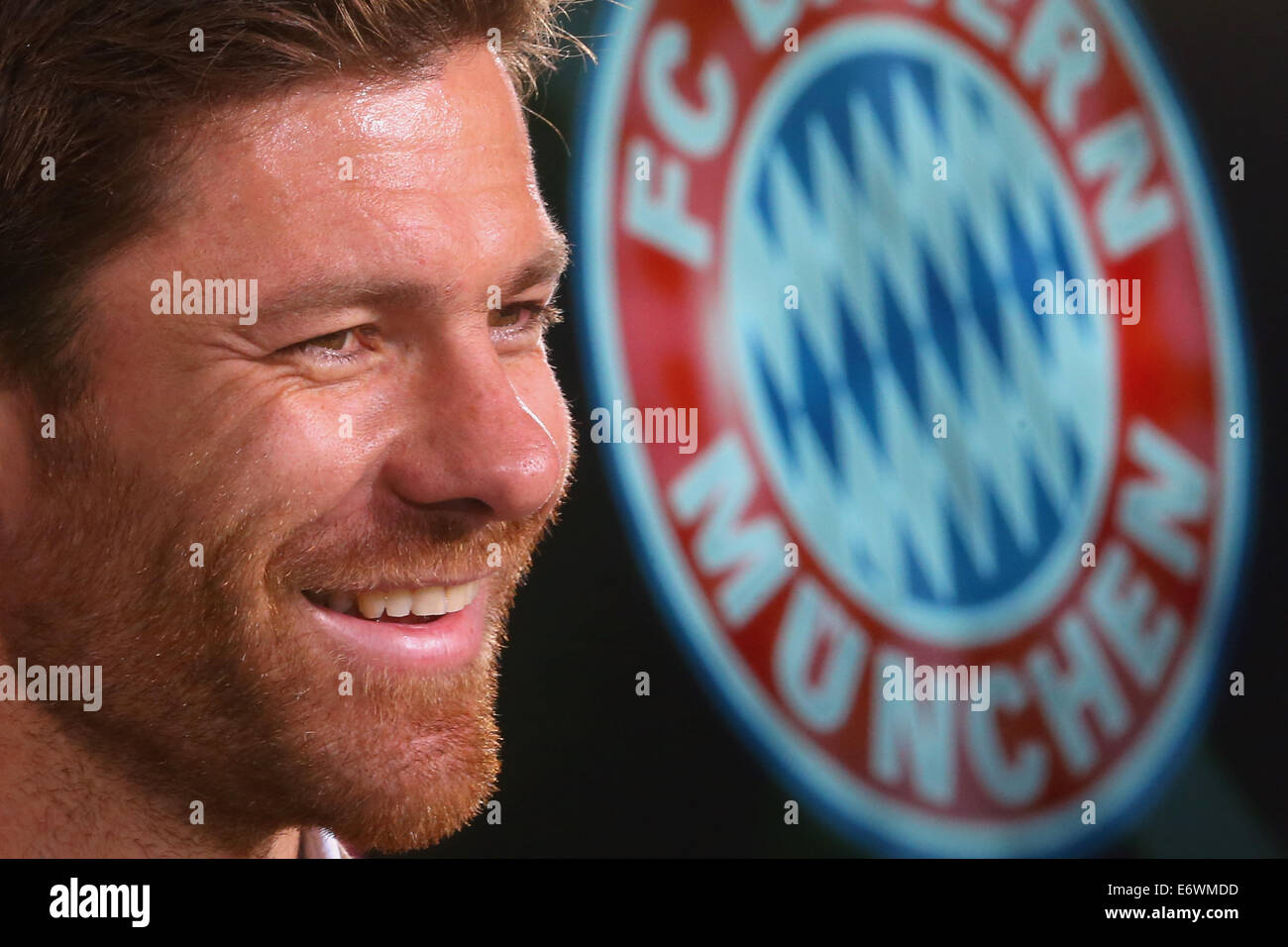 New signing Xabi Alonso of FC Bayern Munich smiles during a press conference at Bayern Muenchen's headquarter Saebener Strasse in Munich, Germany, on 01 September 2014. Photo: Alexander Hassenstein/dpa Stock Photo