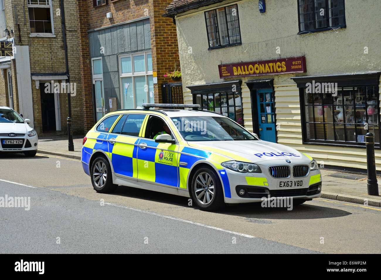 Police car on call, High Street, Chipping Ongar, Essex, England, United Kingdom Stock Photo