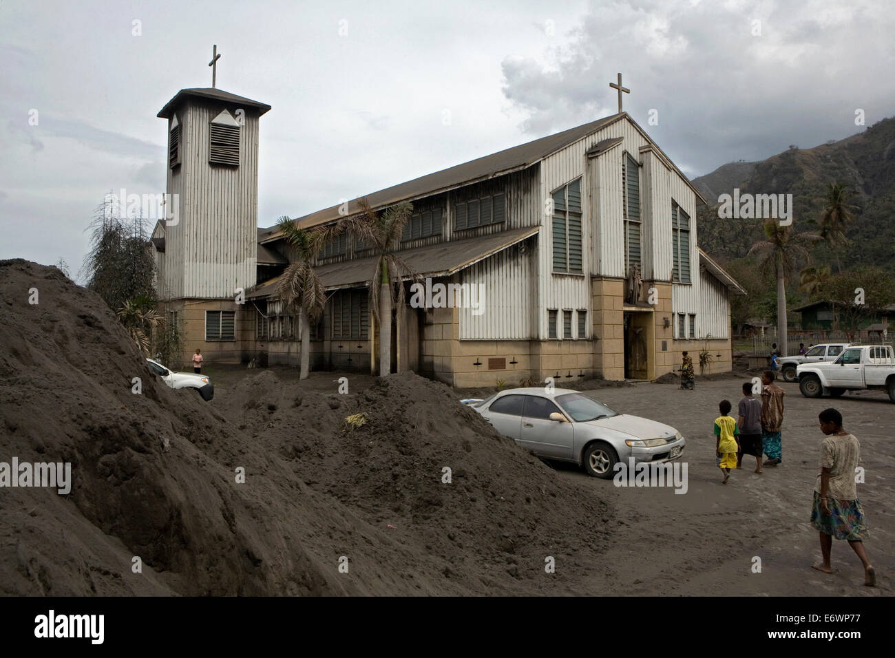Churches and the belief in god is flourishing as the volcano has not stopped for such a long time, Tavurvur Volcano, Rabaul, Eas Stock Photo