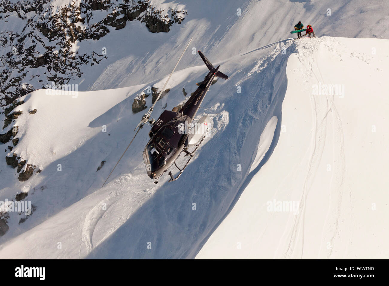 Helicopter landing with winter sportsmen, Skiers and snowboarder, South Island, New Zealand Stock Photo