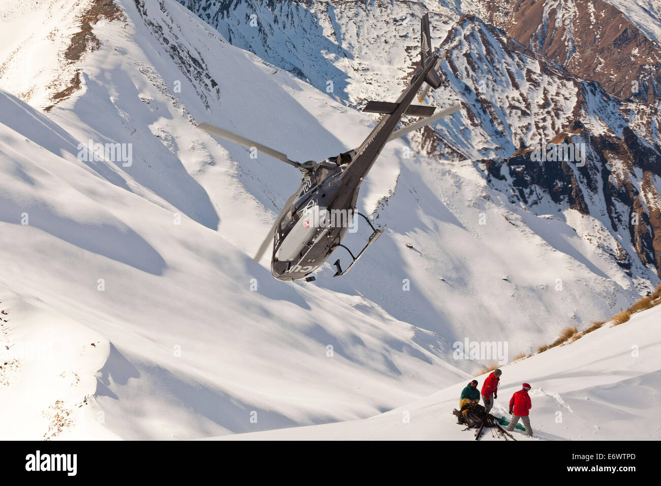 Helicopter landing with winter sportsmen, Skiers and snowboarders, South Island, New Zealand Stock Photo