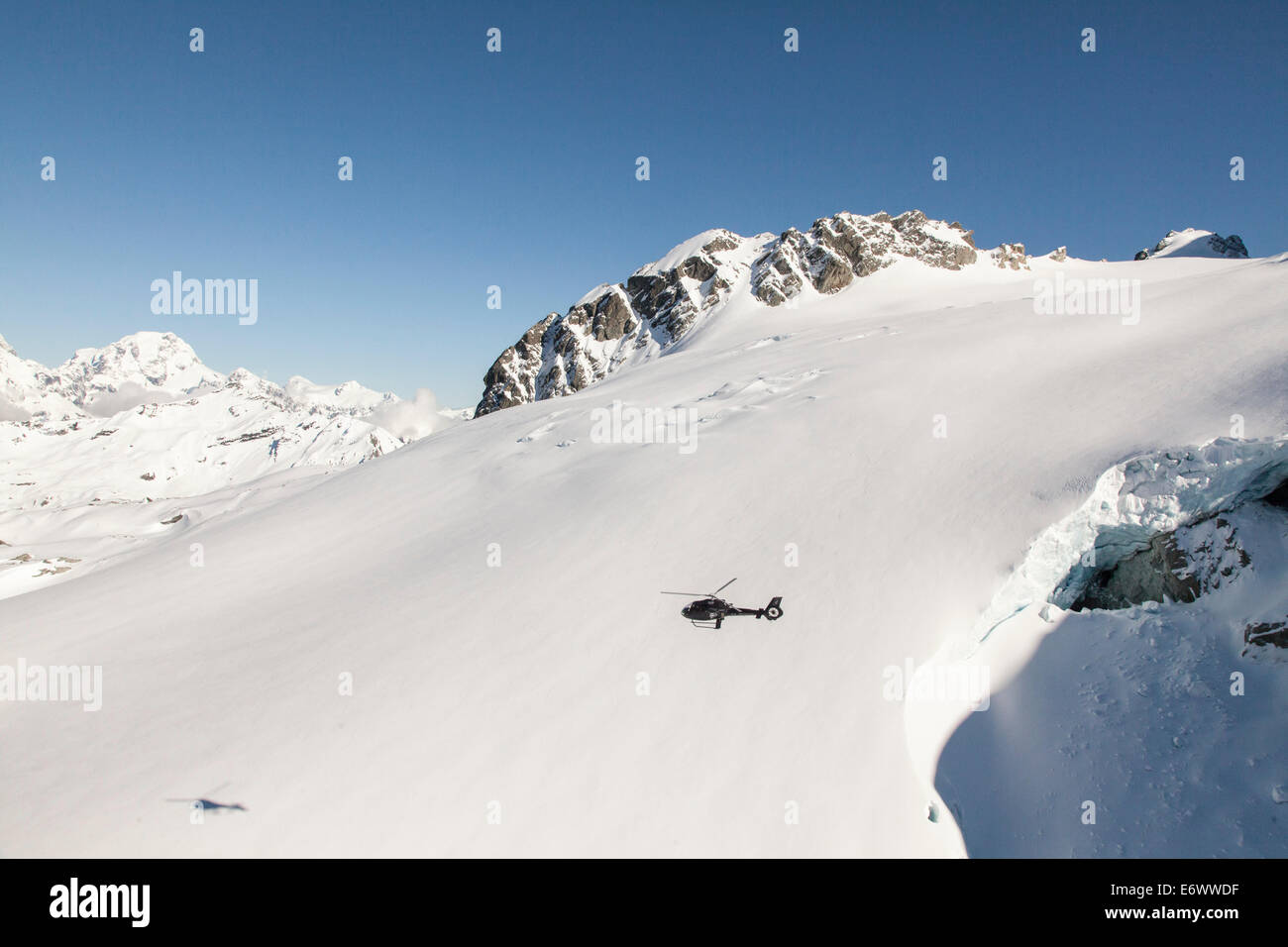 Helicopter flight over snowy mountains hi-res stock photography and ...