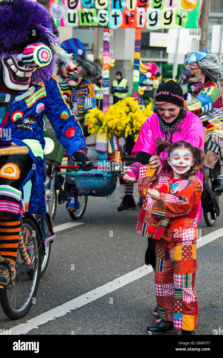 Little girl dressed up as a clown at the carnival procession, Carnival of Basel, canton of Basel, Switzerland Stock Photo
