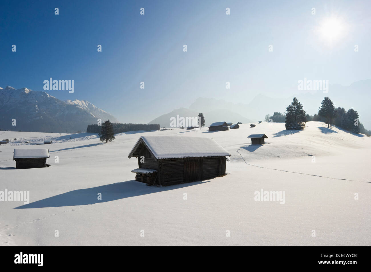 Snow covered huts near Mittenwald, Bavaria, Germany Stock Photo