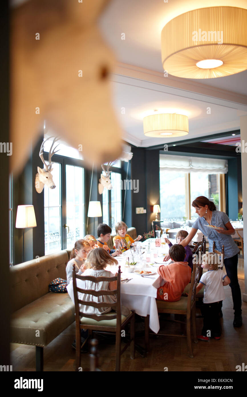 Kids having lunch in the restaurant of Hotel Haus Hirt, Bad Gastein, St. Johann im Pongau, Salzburg, Austria Stock Photo