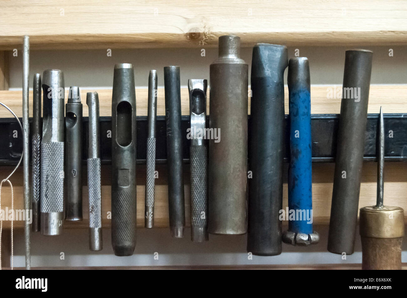 Arranged tools in leather workshop Stock Photo