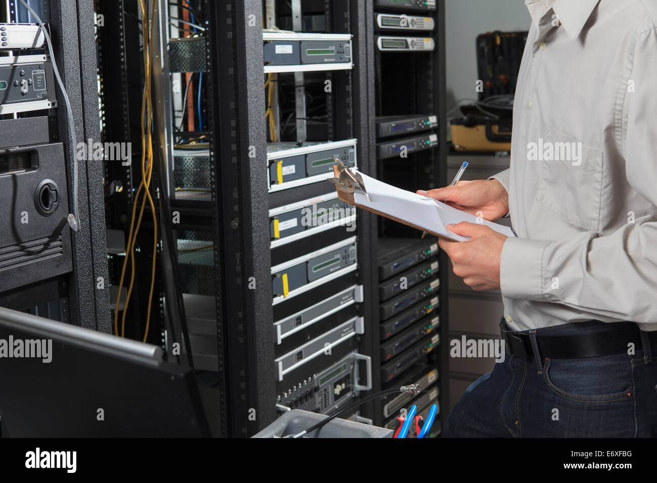 Network engineer documenting configuration Stock Photo
