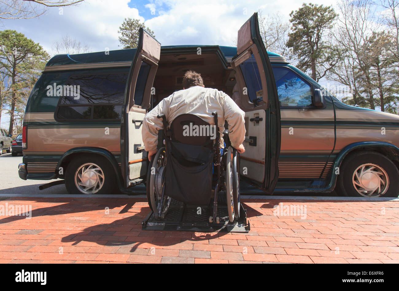 Man with Spinal Cord Injury entering his accessible van Stock Photo