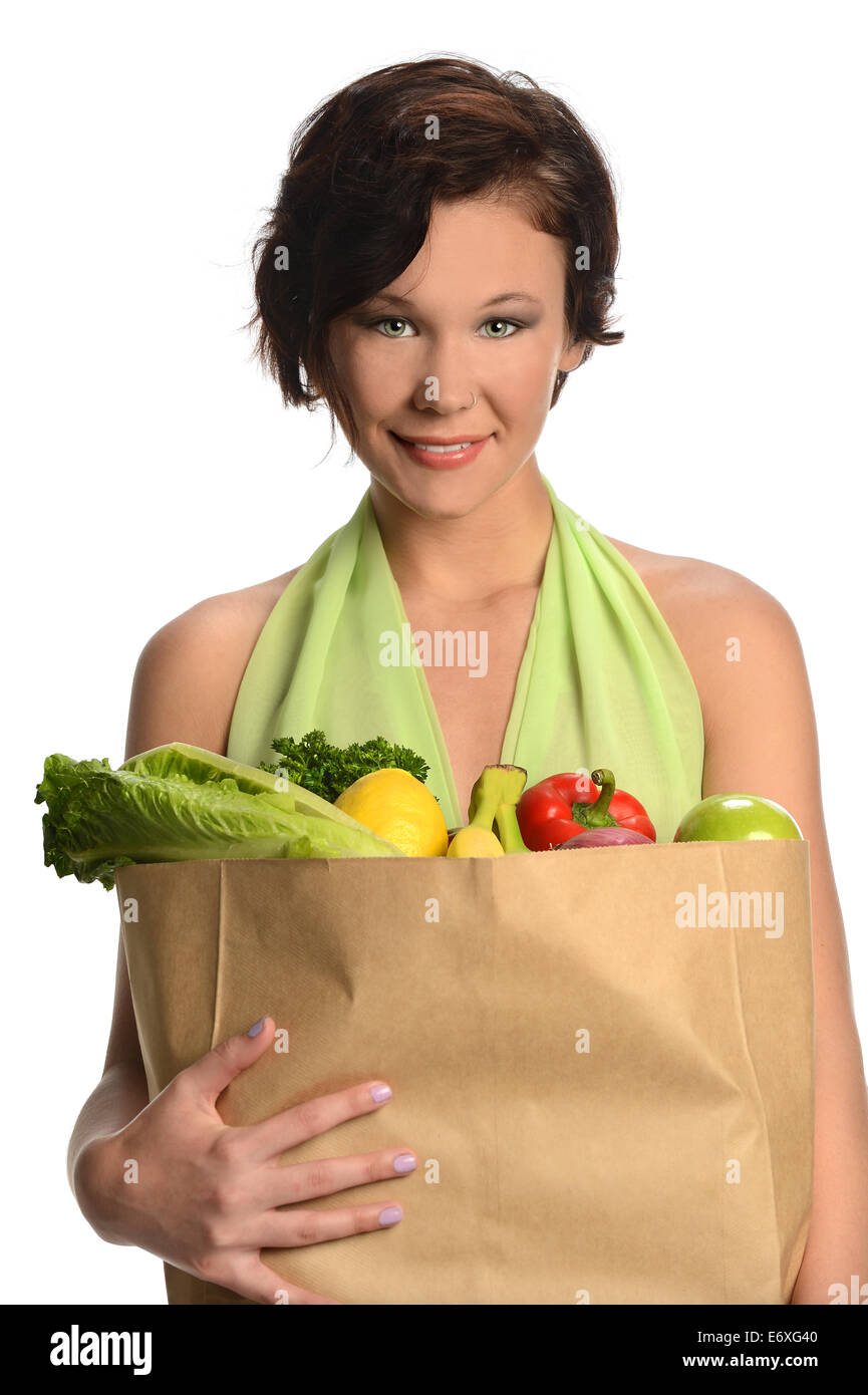 Portrait of beautiful young woman holding bag of groceries isolated over white background Stock