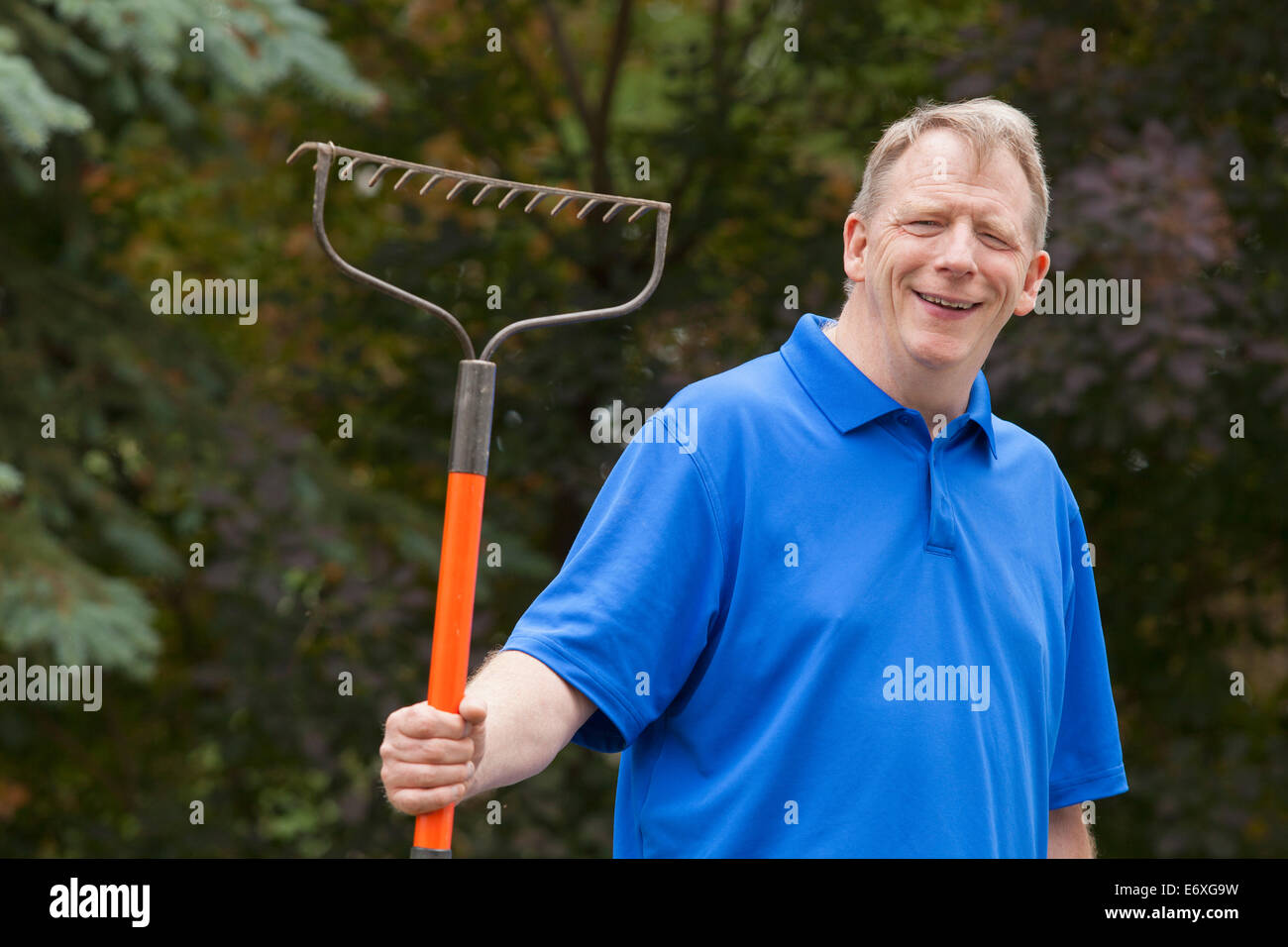 Holding rake hi-res stock photography and images - Alamy