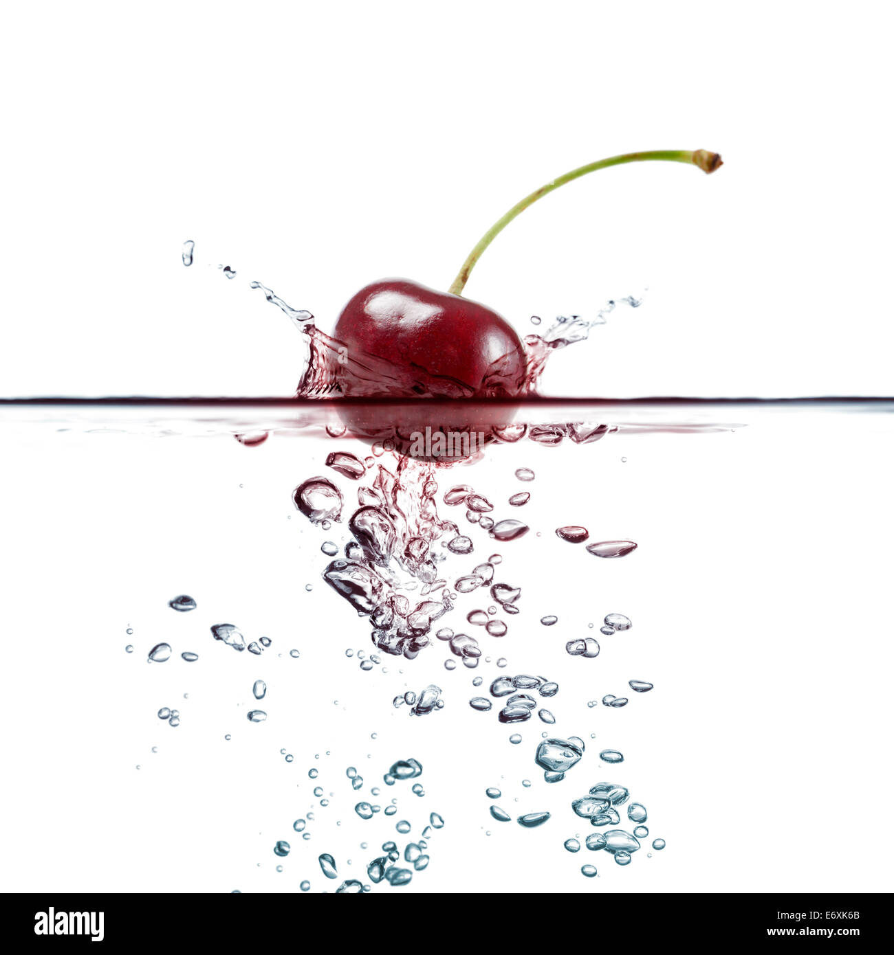 cherry splash in transparent water, on white background Stock Photo - Alamy