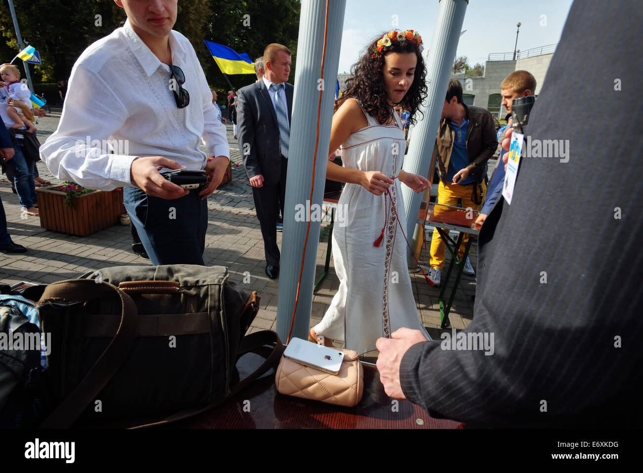 Young woman passes through metal detector on military parade on Independence Day of Ukraine in Kyiv Stock Photo