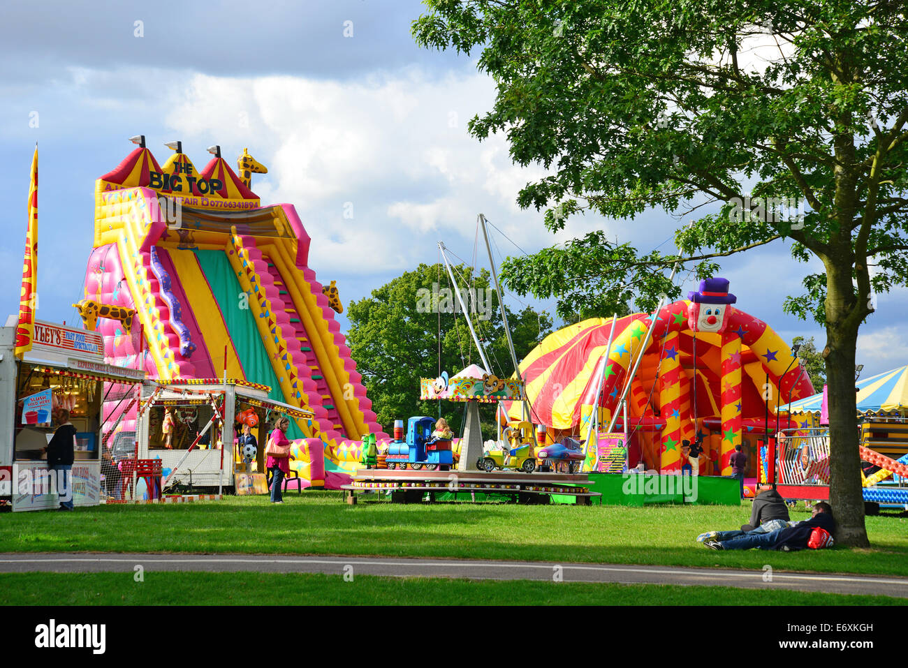 Rides and inflatables at touring funfair in Gadebridge Park, Hemel Hempstead, Hertfordshire, England, United Kingdom Stock Photo