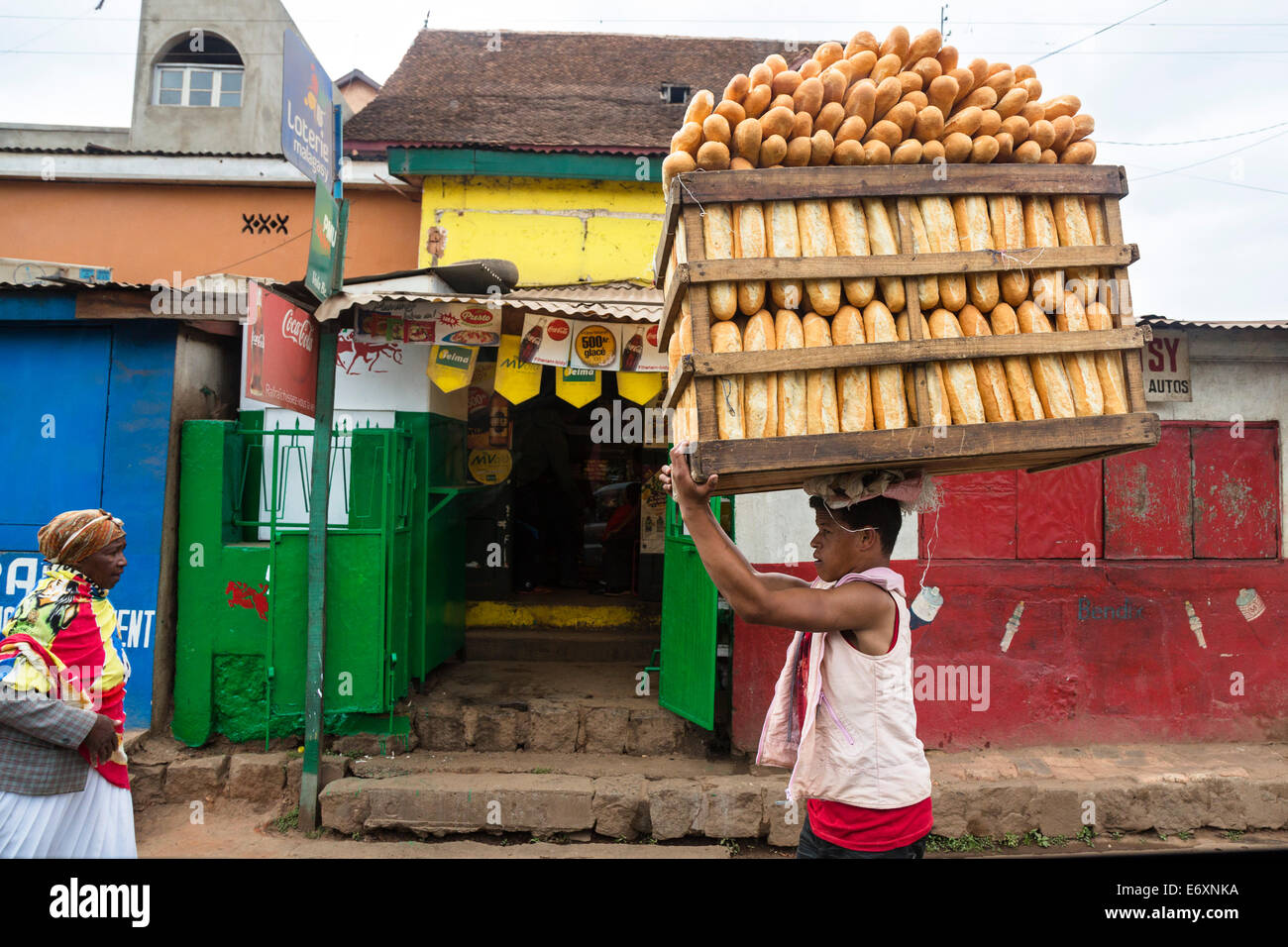 Man delivering bread, Bread deliverer, street scenario, Antananarivo, capital, Madagascar, Africa Stock Photo