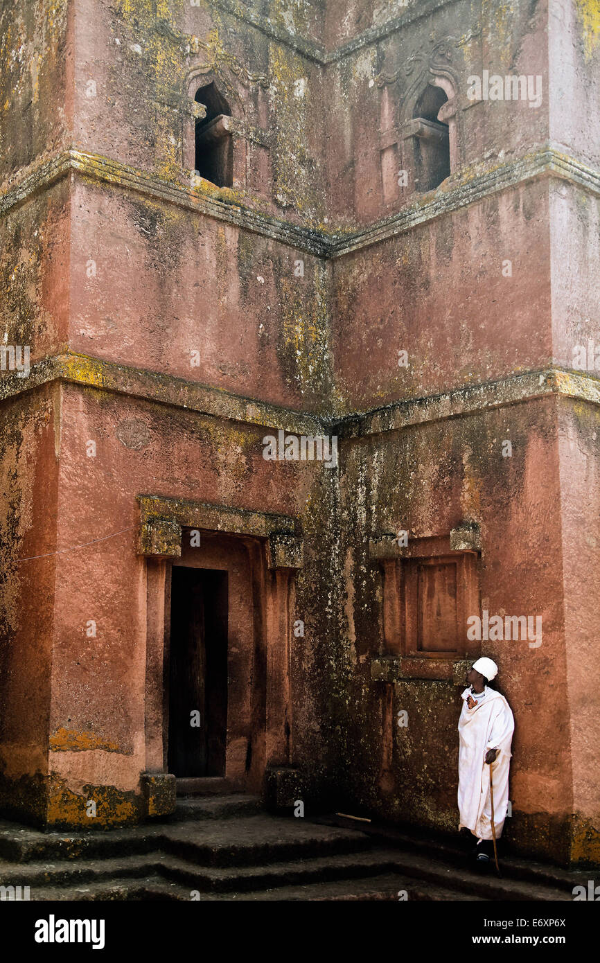Religious man in front of the church of St. George, Lalibela, Ethiopia, Africa Stock Photo