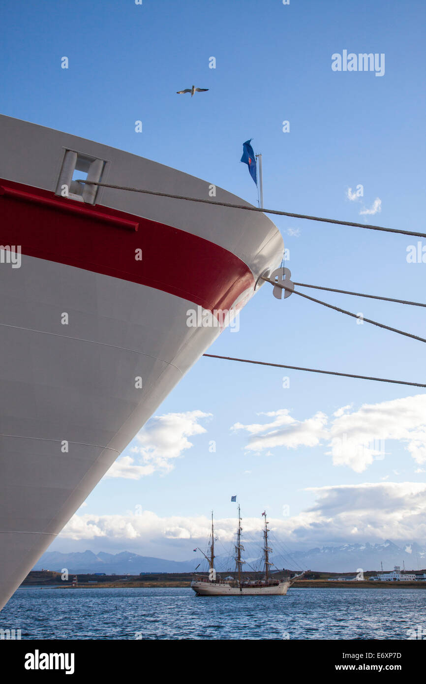 Bow of cruise ship MS Deutschland (Reederei Peter Deilmann) and sailing ship SV Europa in the harbor, Ushuaia, Tierra del Fuego, Stock Photo