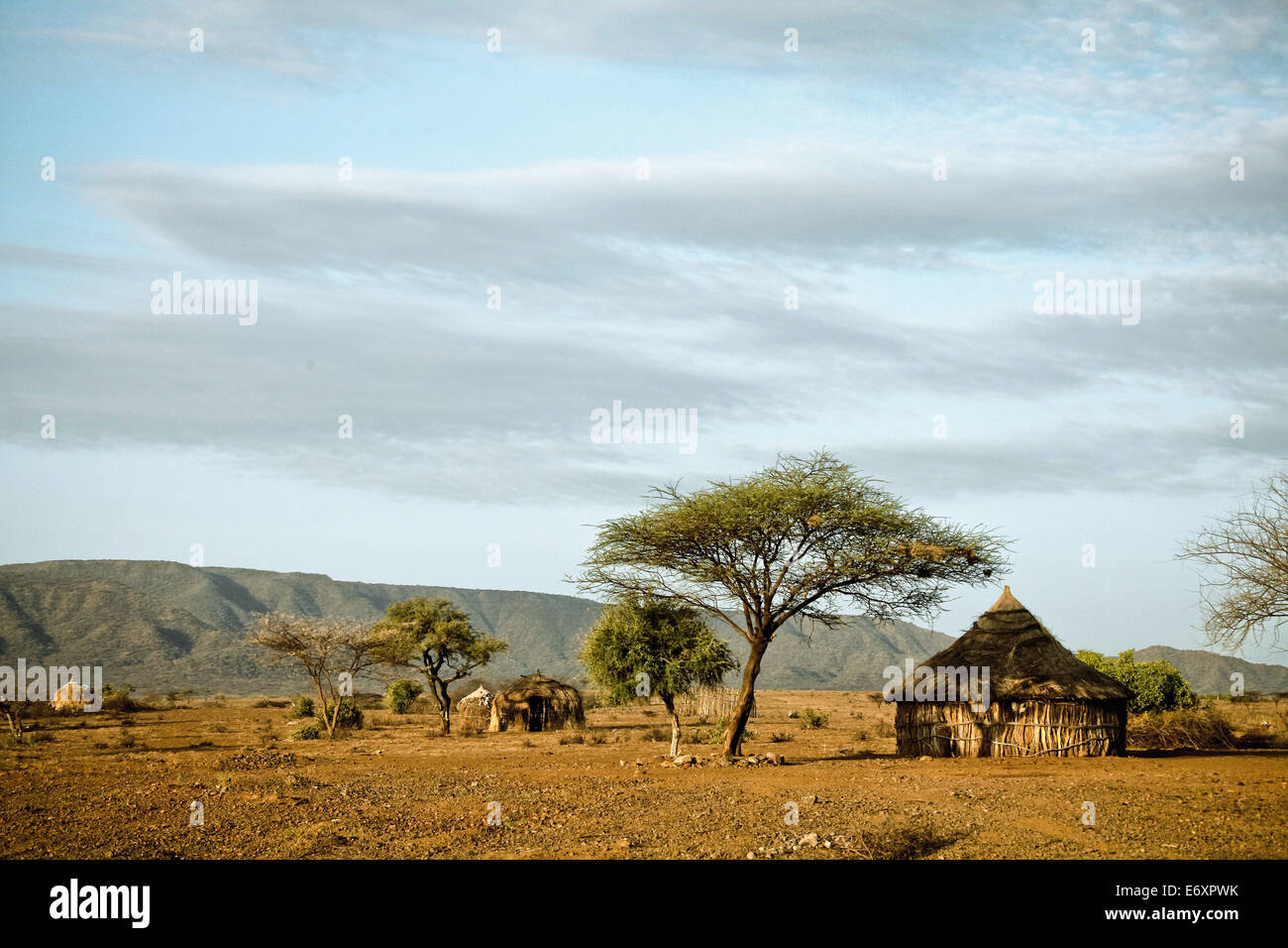 Round huts in bare savanne, Omo valley, South Ethiopia, Africa Stock Photo
