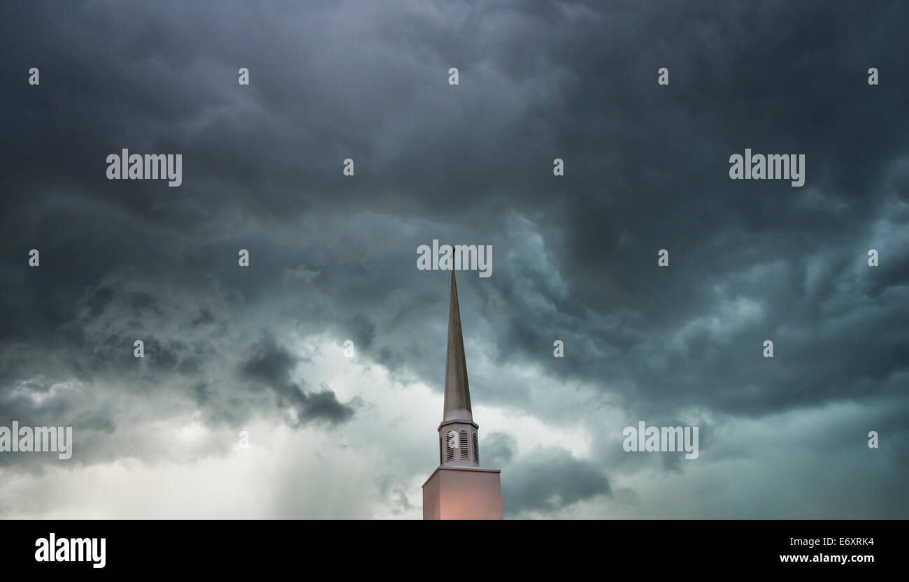 Ominous rain clouds approach a Baptist church in North Florida. Stock Photo