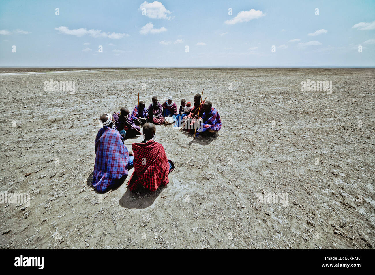 Massai's sitting in a circle in the plains, Ngorongoro, Tanzania, Africa Stock Photo