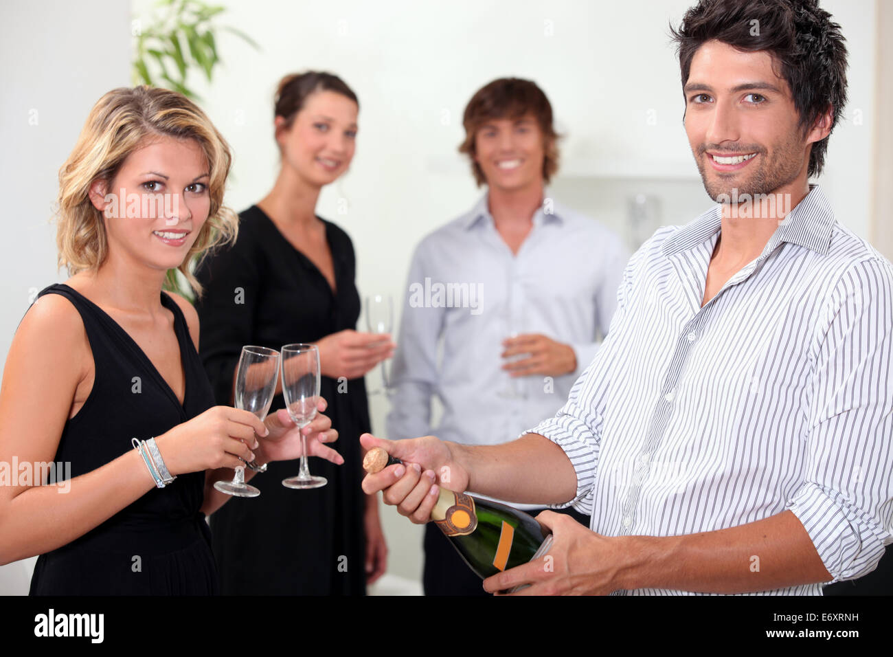 Popping the champagne Stock Photo Alamy