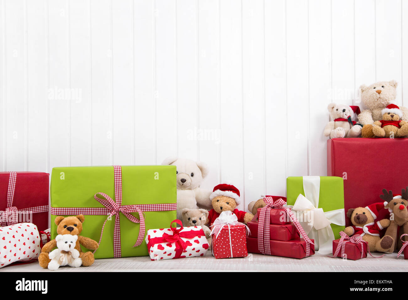 Christmas background with presents in green, red and white with teddy bears Stock Photo