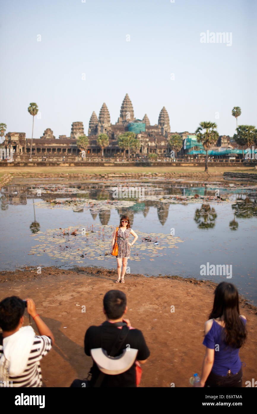 Tourists taking pictures in the morning, Angkor Wat Temple, Angkor Archaeological Park, Siem Reap, Cambodia Stock Photo