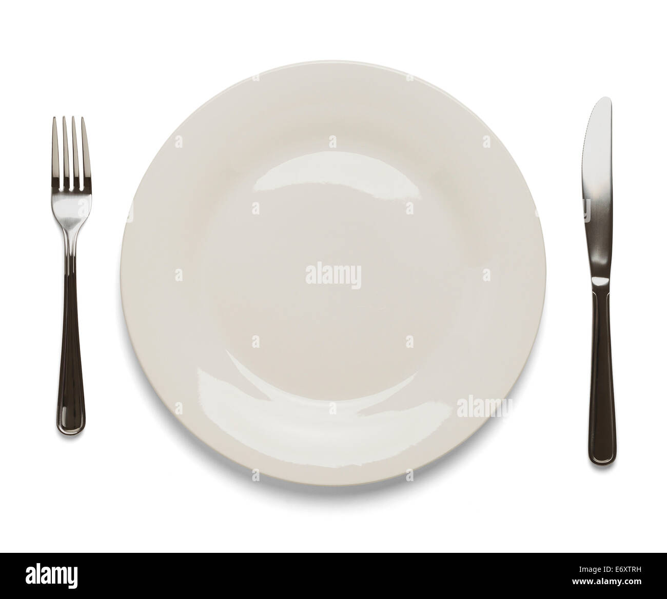 Dinner Plate with Silverware Isolated on White Background. Stock Photo