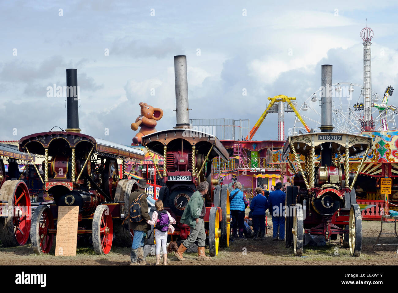Showman's steam traction engines lined up at the traditional fairground at the 2014 Great Dorset Steam Fair get admiring glances Stock Photo