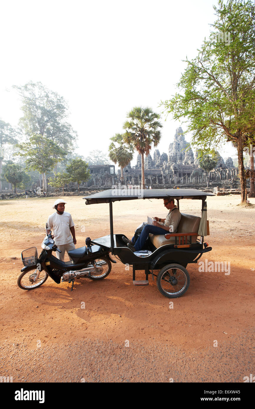 Tuk-tuk near Bayon Temple, Angkor Archaeological Park, Siem Reap, Cambodia Stock Photo