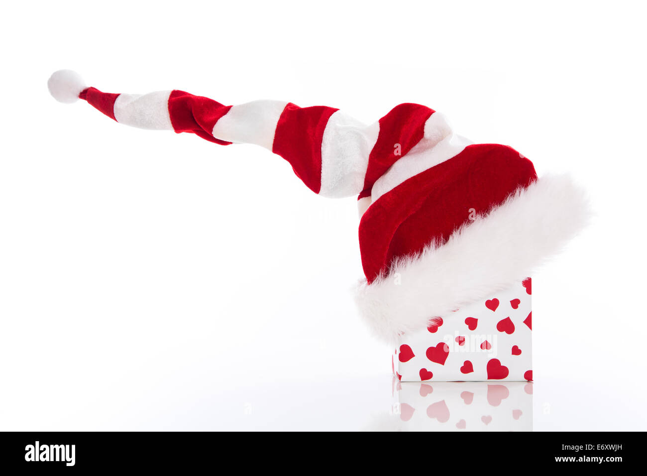 Santa's hat with red and white gift box, isolated on white background ...