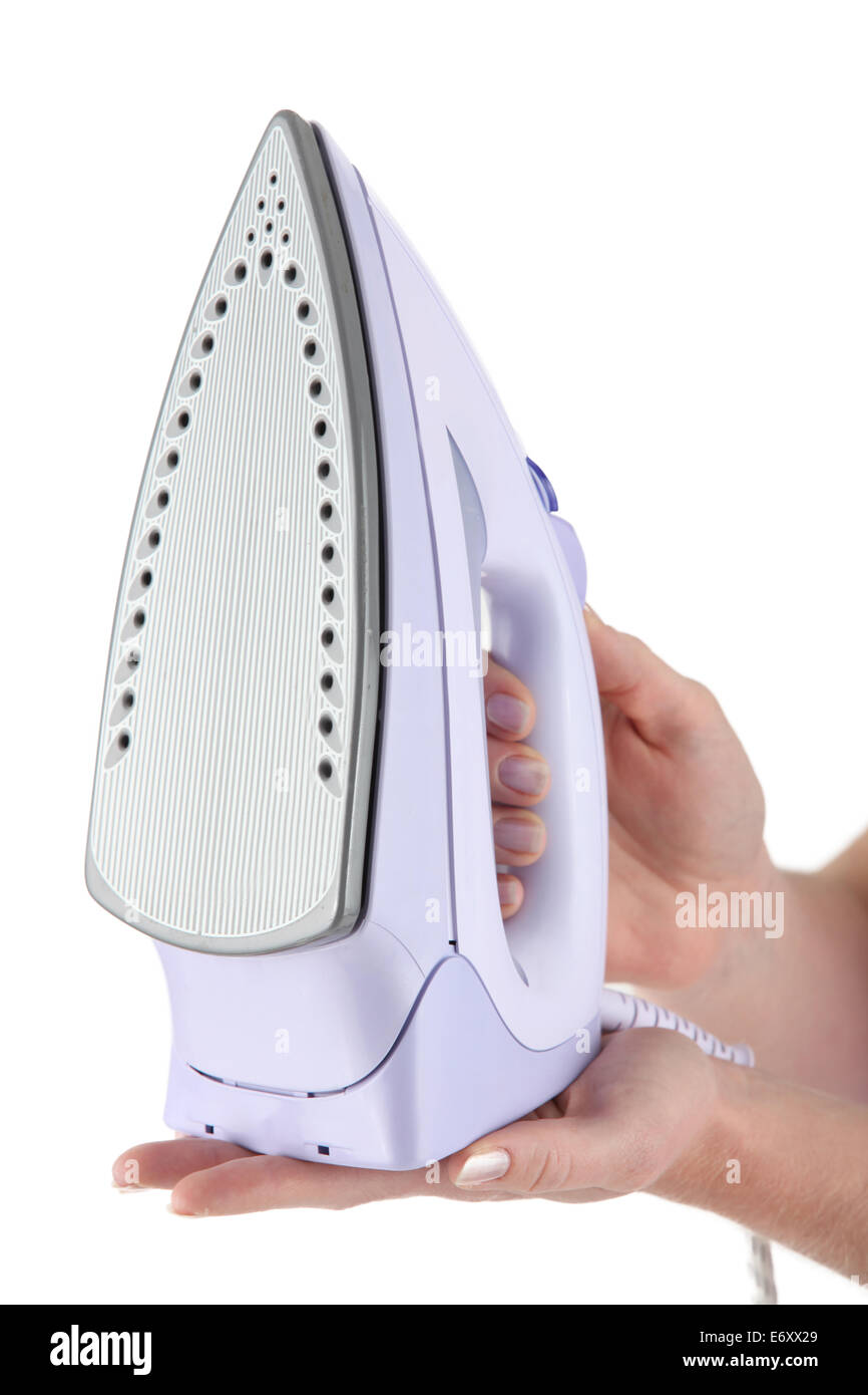 Hand with an iron Stock Photo Alamy