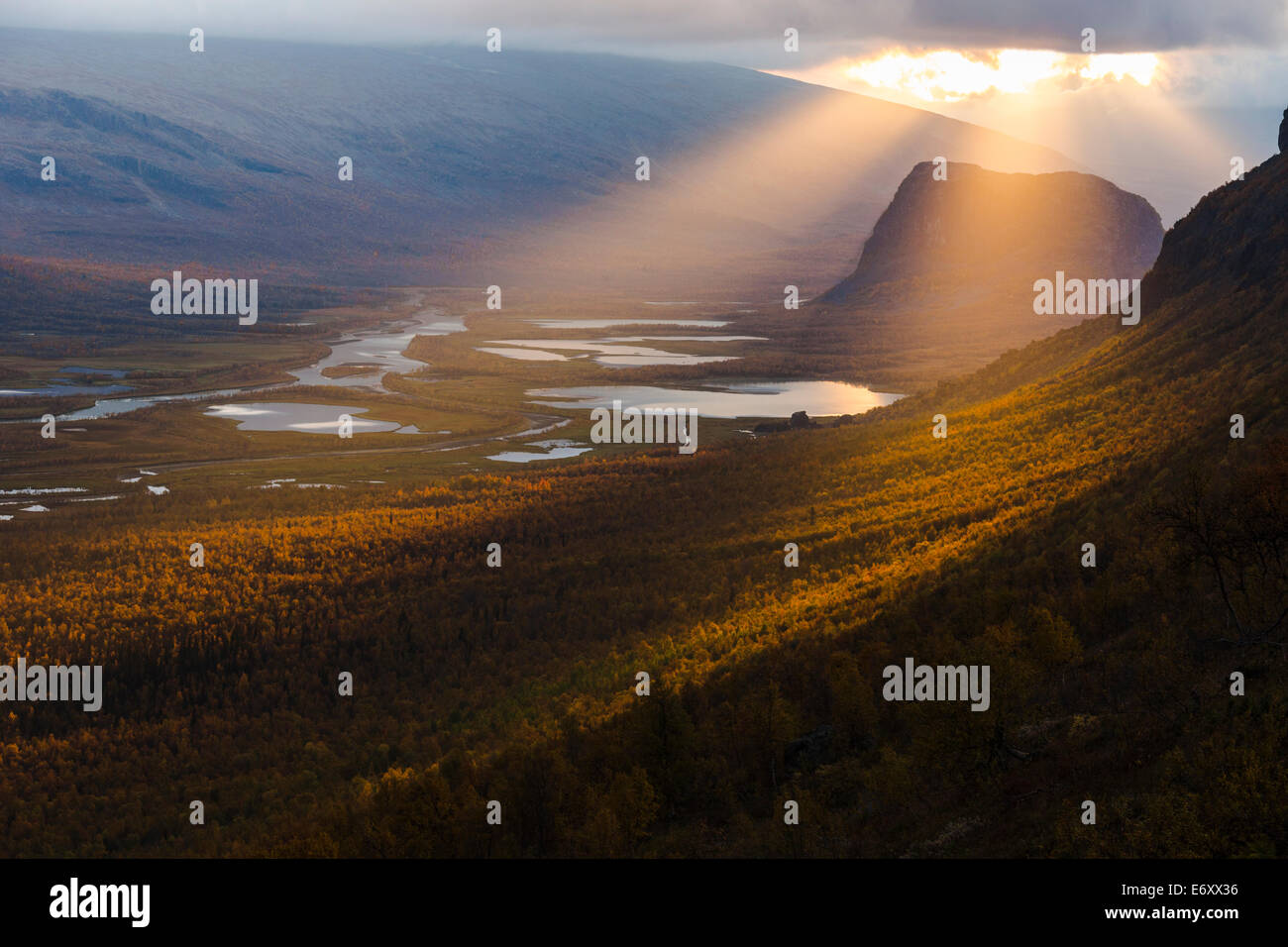 Sarek national park with with the Laitaure delta and mount Namatj in autumn season and the sun breaking through the clouds in Sw Stock Photo