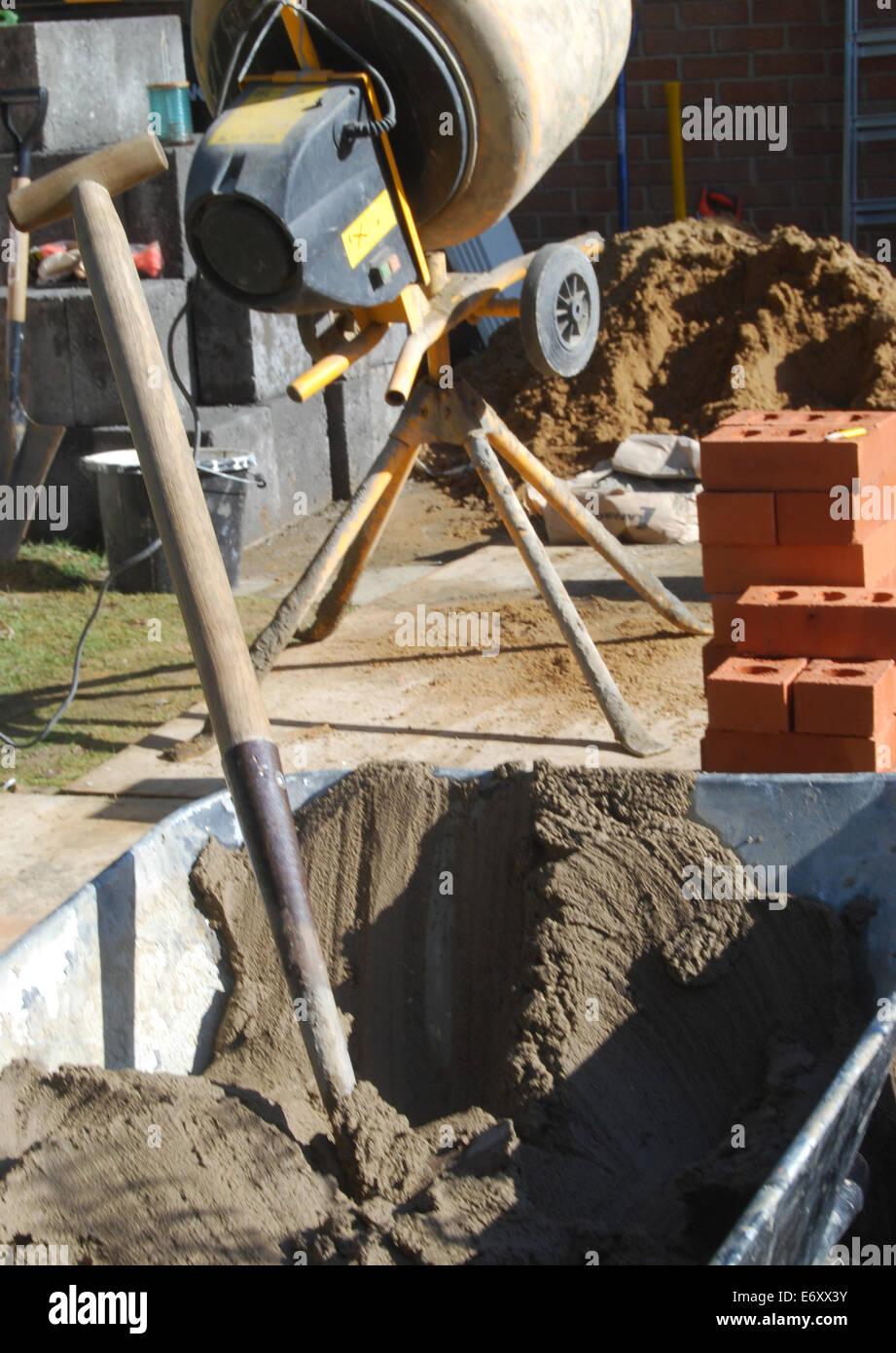 Small construction site showing builders tools and materials in garden