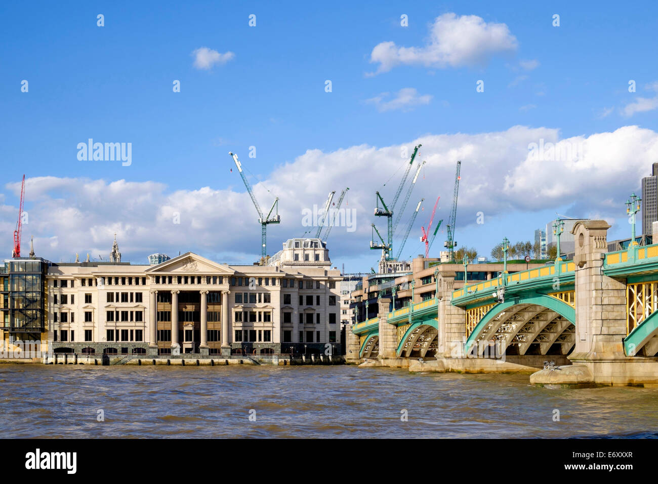 London, showing southwark bridge and the many construction cranes