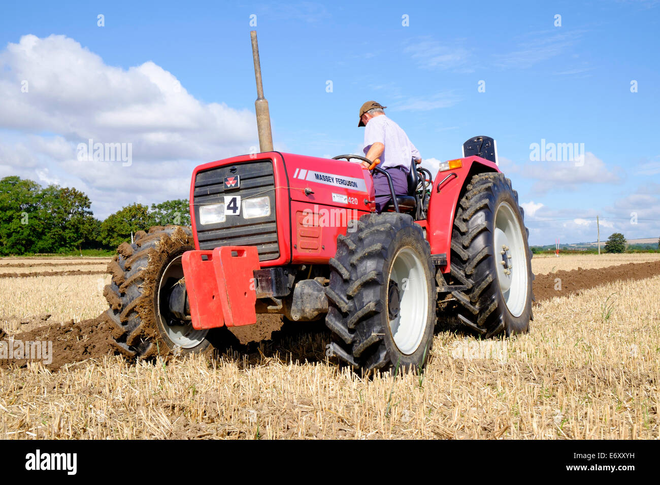 red massey ferguson 420 tractor using plough whilst competing in a ...